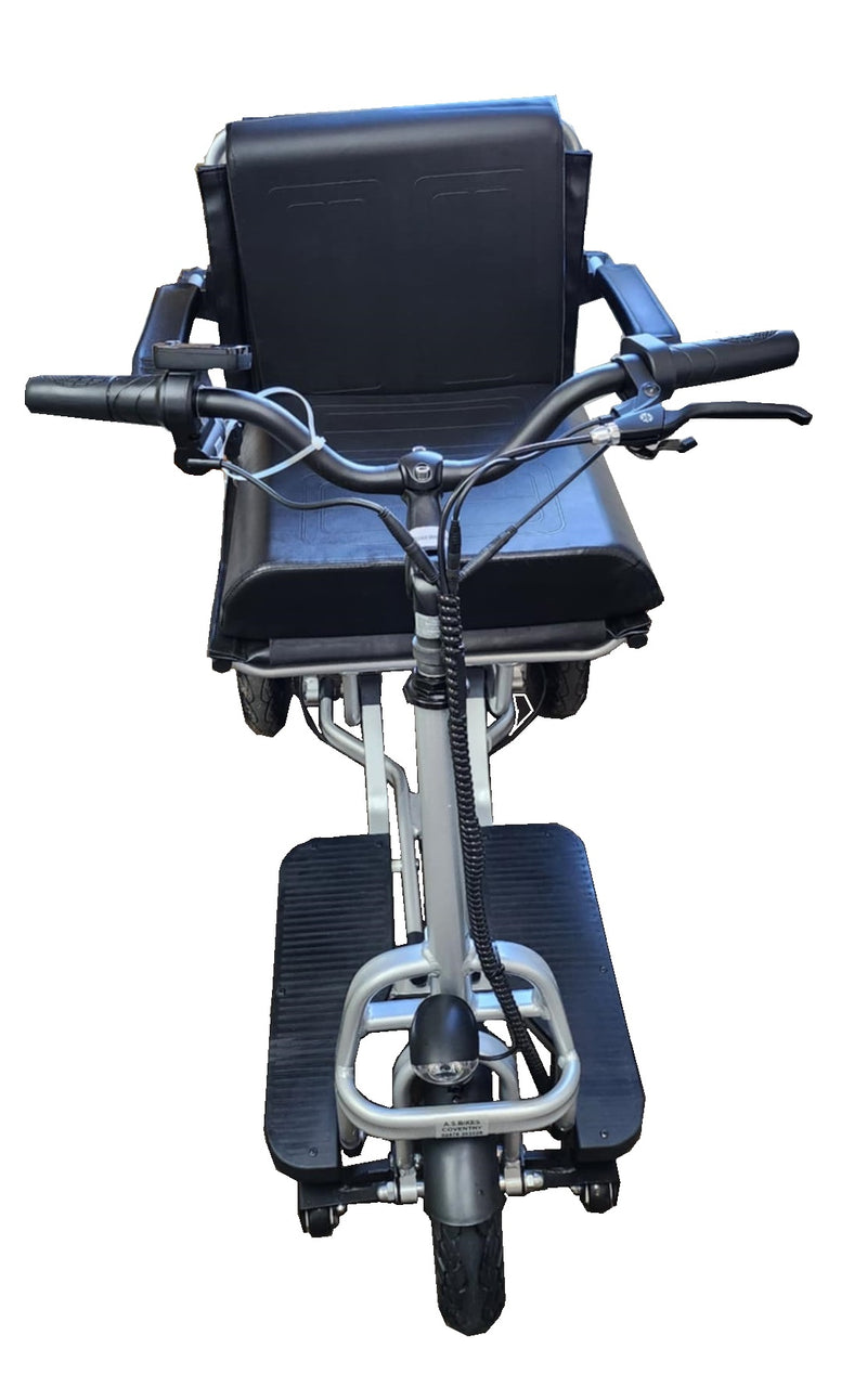 The folding mobility scooter head on, showing the handlebars, the seat and the two footplates