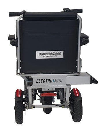 The folded scooter from behind, showing the Electromobi branding and the rear stabiliser wheels