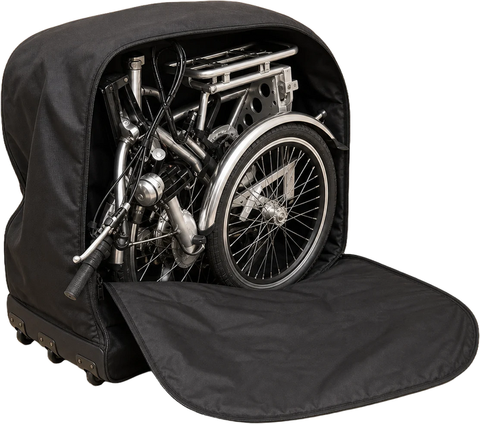 The folded tricycle stowed inside its wheeled travel bag